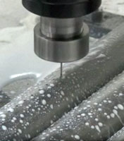 Sistema CNC para perforado de caños en la industria de la combustión.